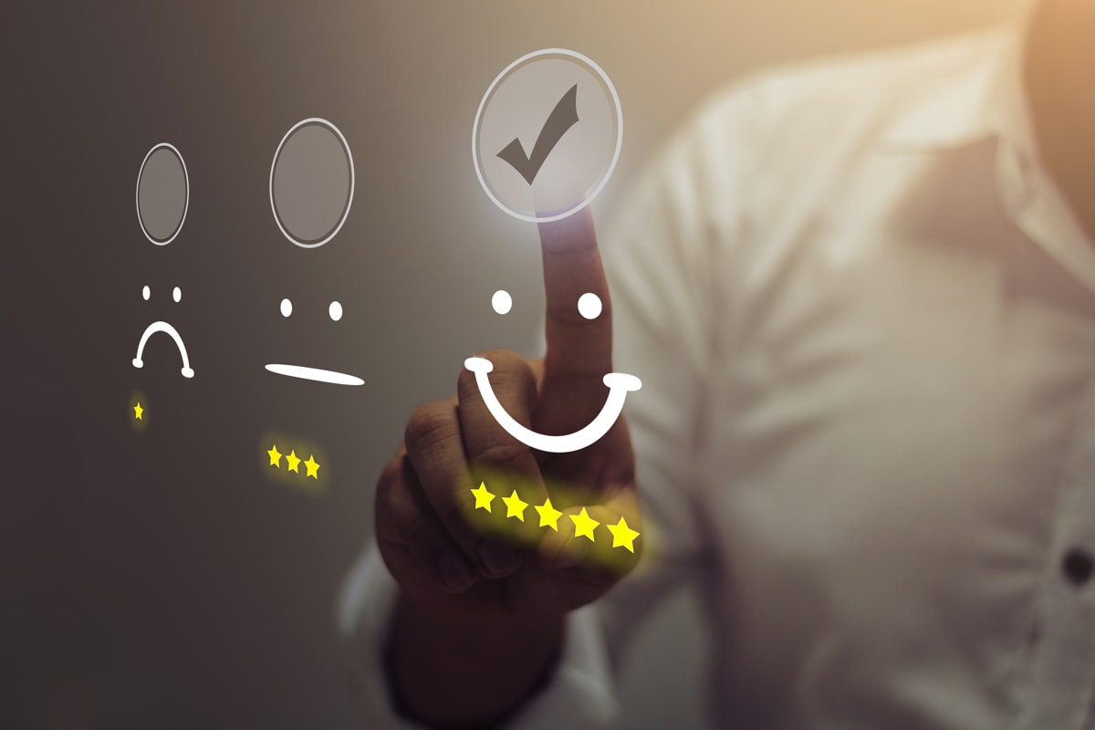 An enterprise user selects a five-star rating with a smiley face to indicate satisfaction with customer support.