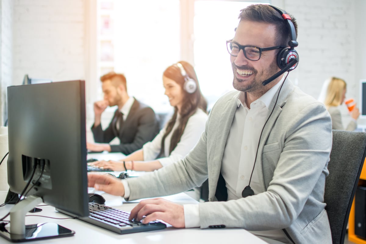 A customer service rep provides support with a smile, like the top-notch support offered by the top access point brand.